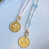 pink and blue beaded necklaces with gold pendant coins