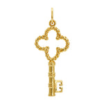Gold key-shaped charm on a white background