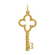 Gold key-shaped charm on a white background