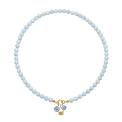 Necklace with light blue beads and a gold charm on a white background