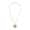 gold scalloped charm with blue gemstones on an aquamarine stone strand of beads
