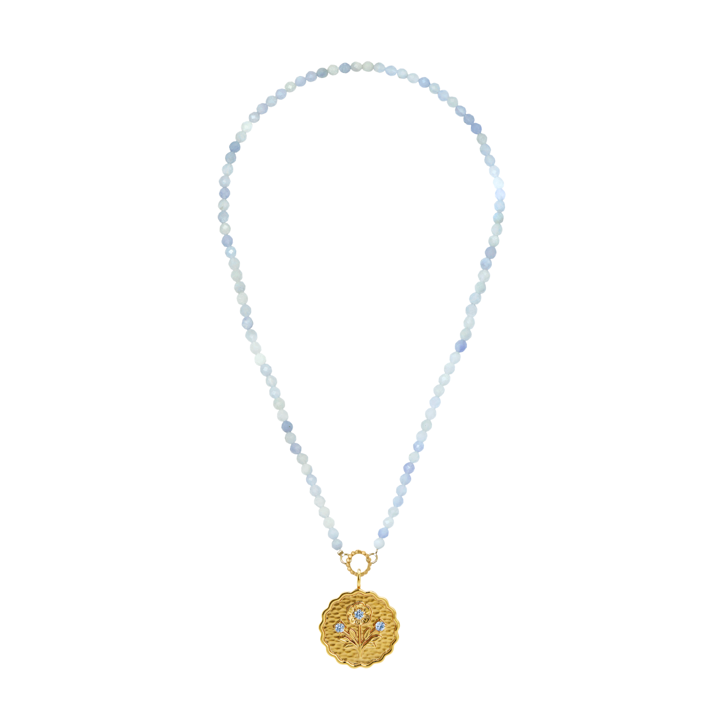 gold scalloped charm with blue gemstones on an aquamarine stone strand of beads