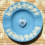 blue lace agate heart charm on a blue plate
