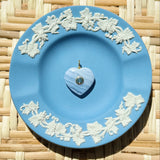 blue lace agate heart charm on a blue plate