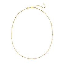 Gold necklace on a white background