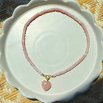 pink stone heart on rose beaded strand