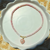 pink stone heart on rose beaded strand