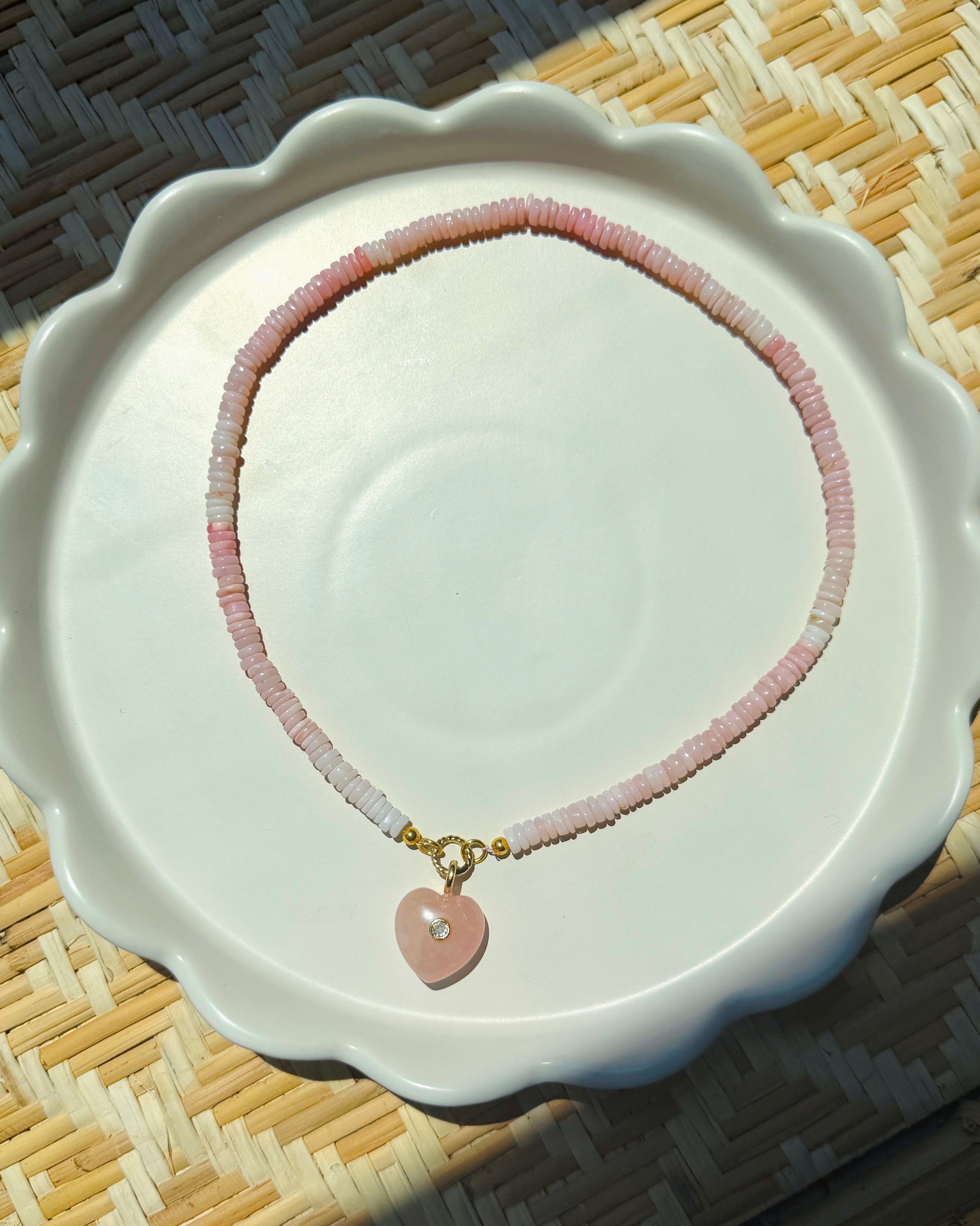 pink stone heart on rose beaded strand