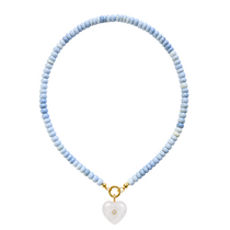 Necklace with light blue beads and a heart-shaped pendant on a white background