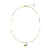 Gold necklace with a blue pendant on a white background
