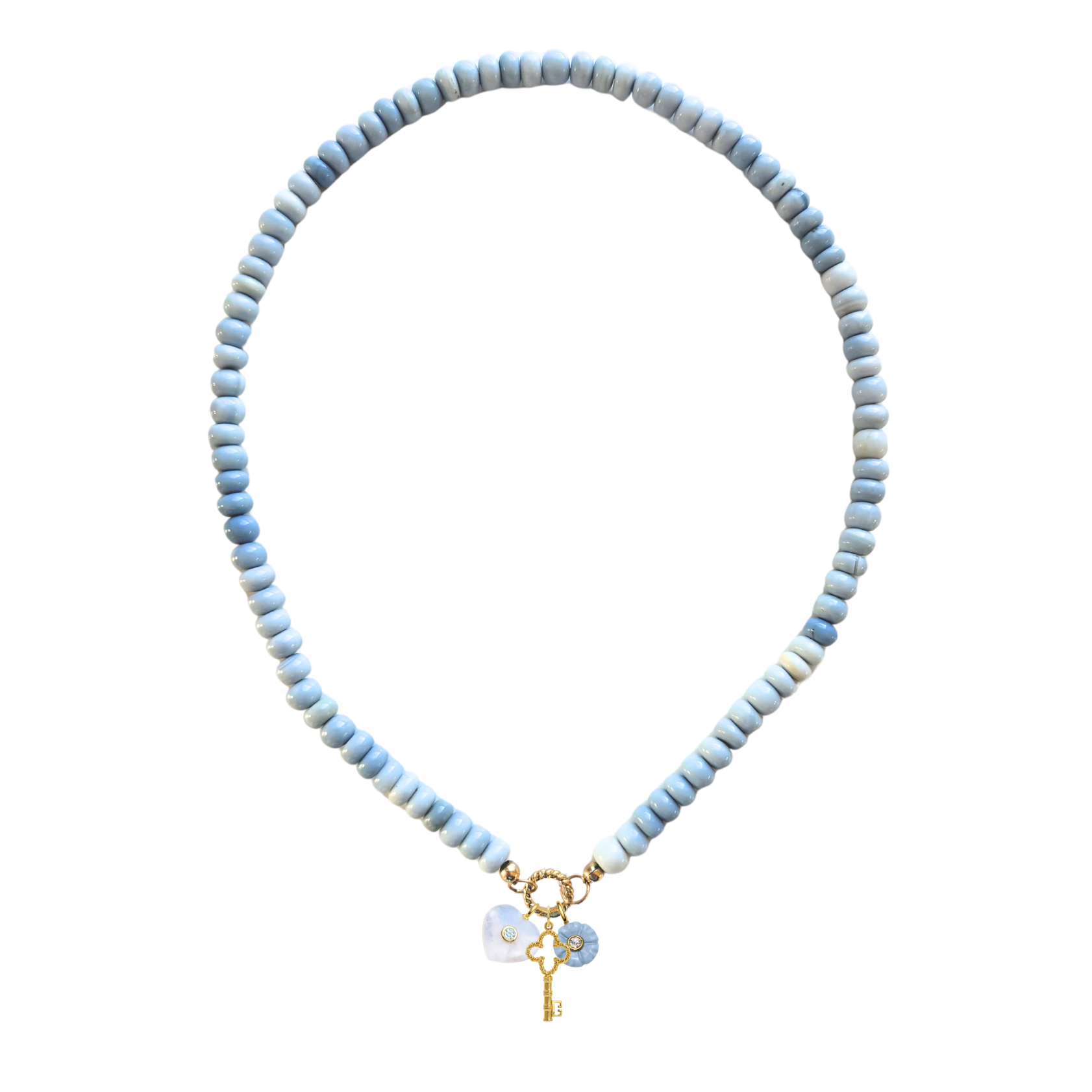 a blue opal beaded chain with three charms hanging including a golden key
