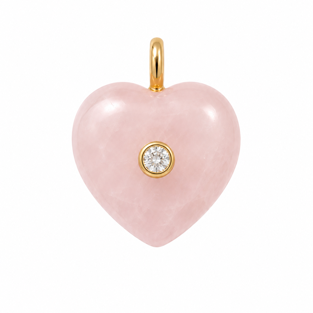 Pink heart-shaped pendant with a gold chain on a white background
