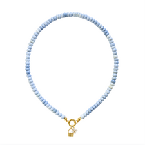 blue beaded necklace with gold and pearl charms