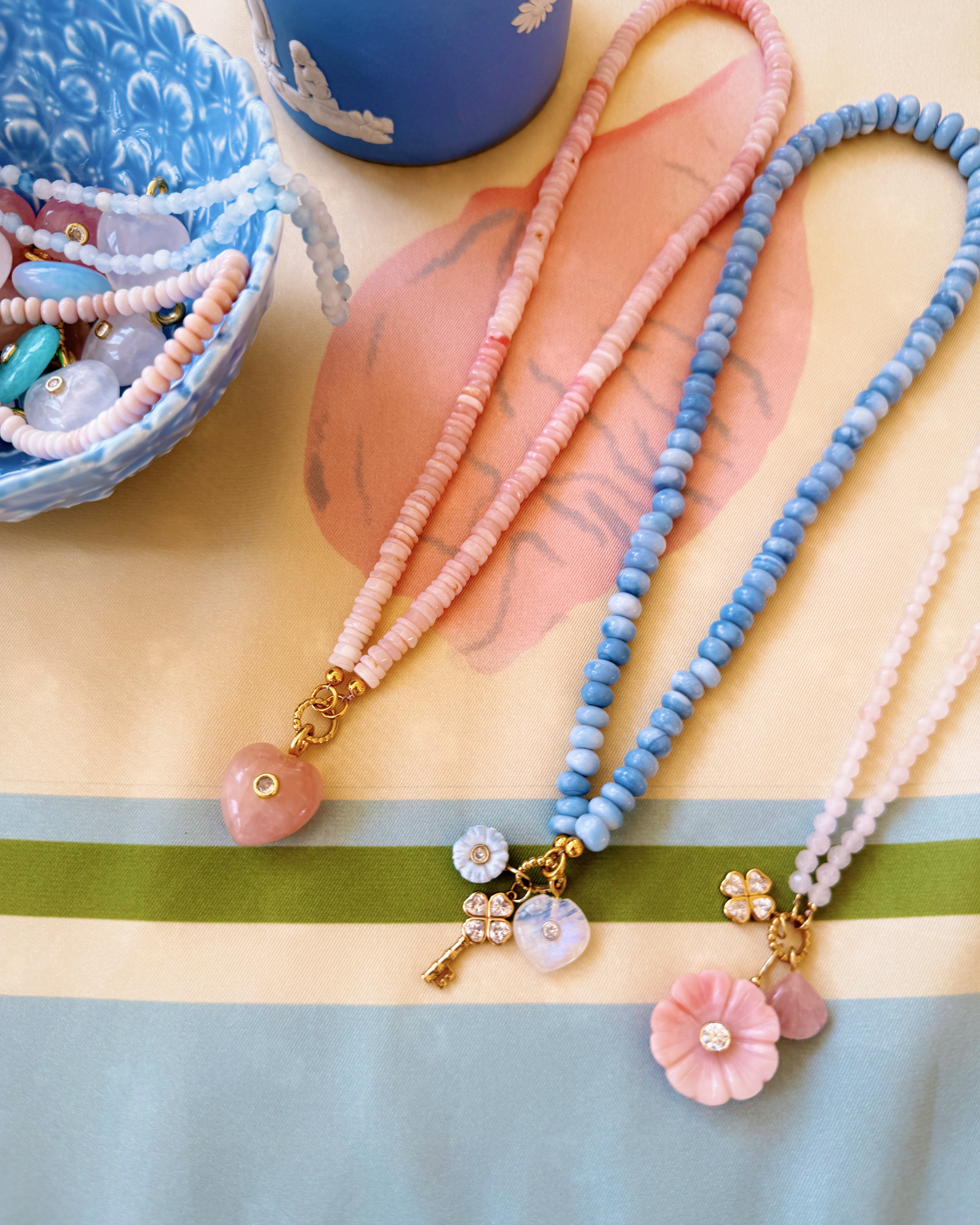 three beaded necklaces on a silk scarf