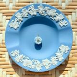 blue floral charm on a blue plate