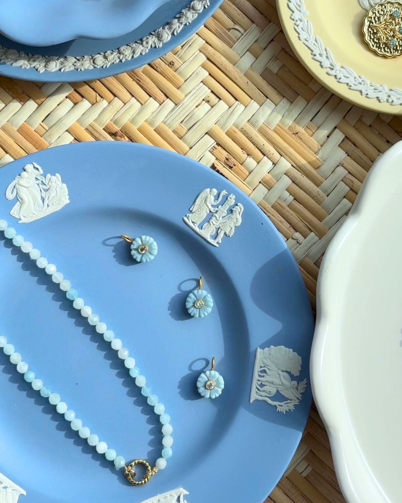 small blue floral bud charms styled on a blue plate