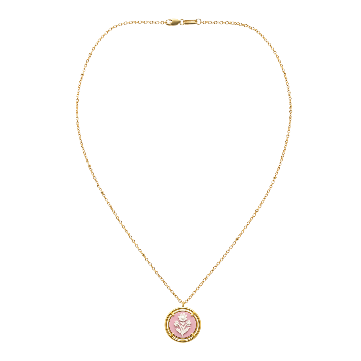 pink cameo pendant on a gold chain on white background
