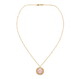pink cameo pendant on a gold chain on white background