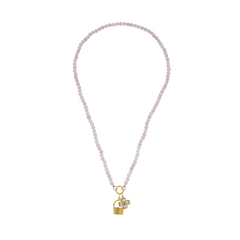 Rose quartz necklace with a golden basket charm and floral charm on a white background
